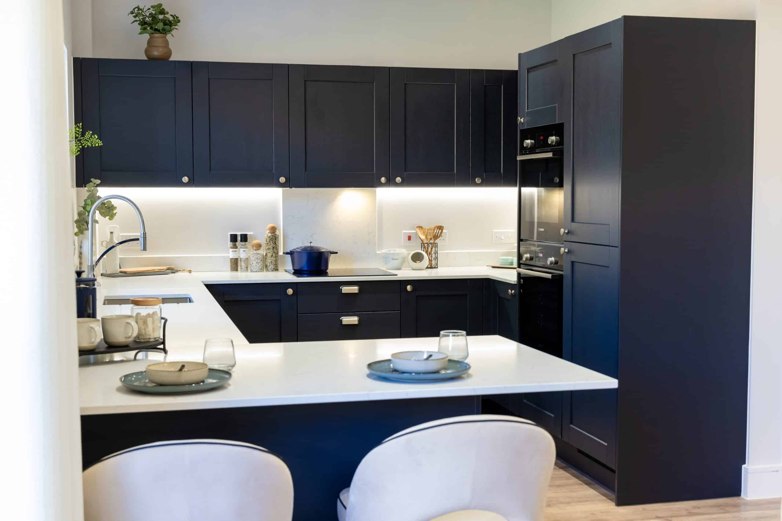 The kitchen at a home in Poppy Fields, showing a breakfast bar.