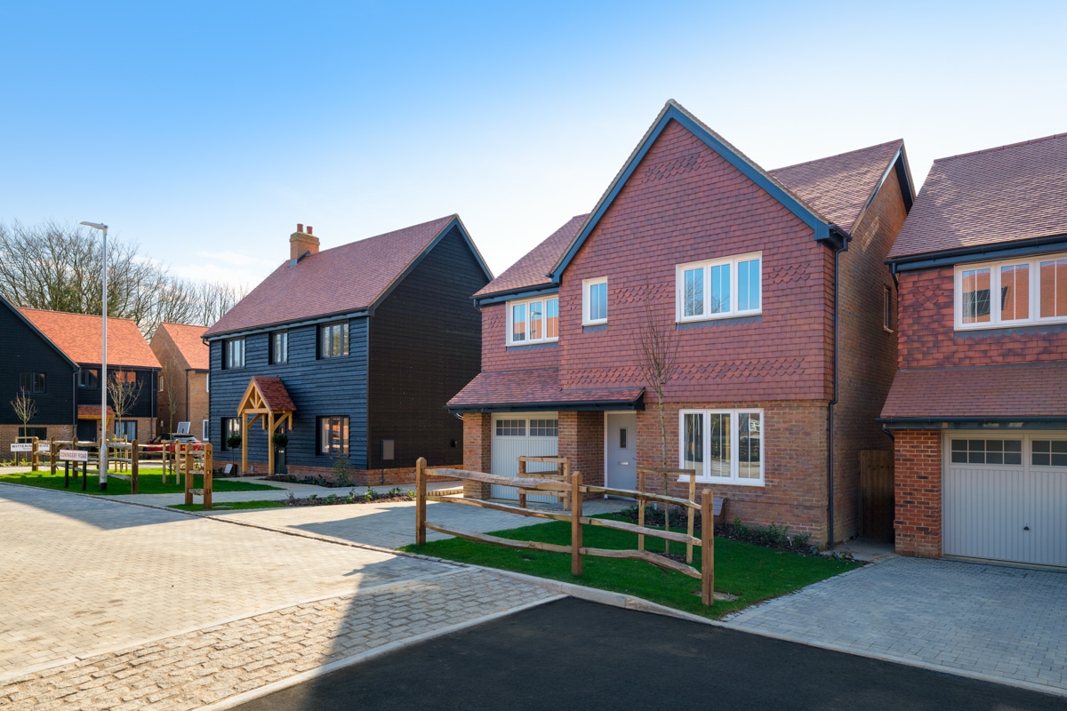 Photo at Poppy Fields showing a home with a integrated garage.